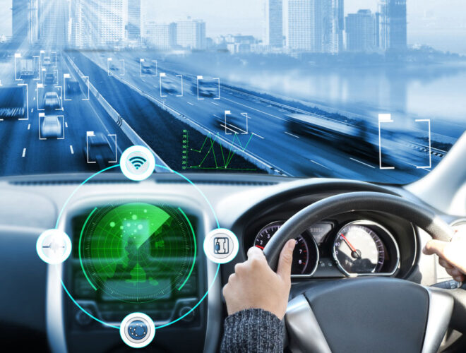Futuristic car being driven on the road with the steering wheel visible