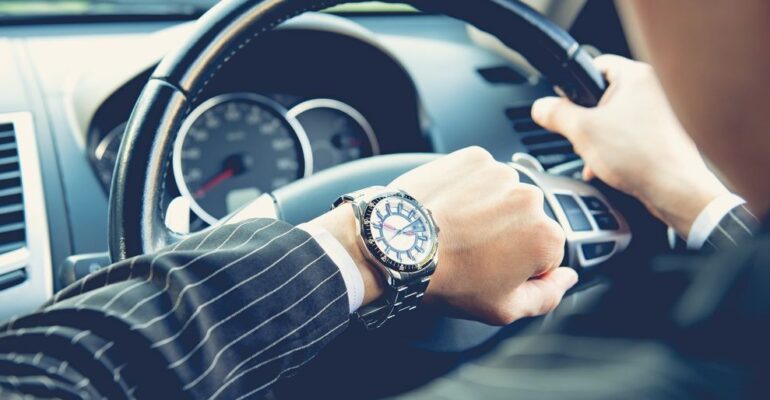 A businessman behind the wheel