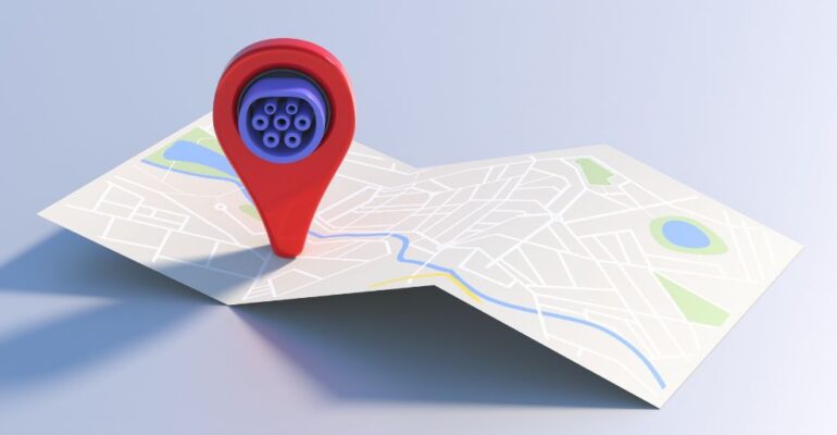 An Ev charging pin hovers over a map